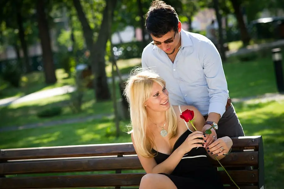 Boy giving rose to his girlfriend